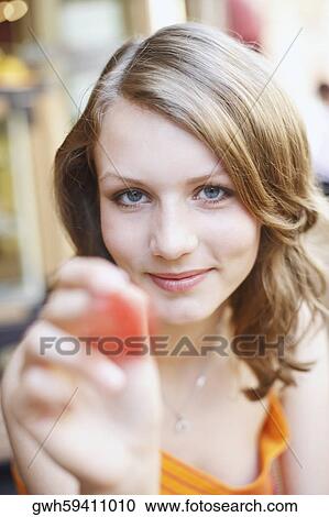 Stock Image - Portrait of a teenage girl smiling. Fotosearch