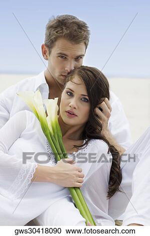 Portrait of a young couple on the beach View Large Photo Image Stock Image - Portrait of a young couple on the beach. Fotosearch