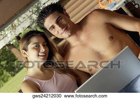 Portrait of a young couple smiling View Large Photo Image Stock Image - Portrait of a young couple smiling. Fotosearch