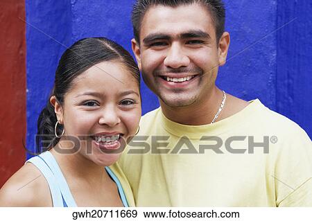 Stock Photo - Portrait of a young couple smiling. Fotosearch