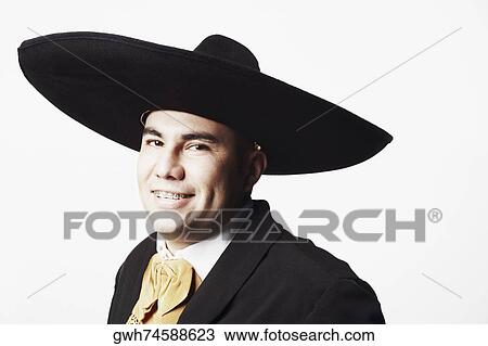 Stock Image - Portrait of a young man in traditional clothing. Fotosearch