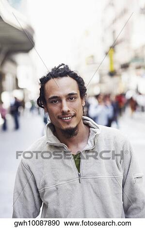 Portrait of a young man smiling View Large Photo Image Stock Image - Portrait of a young man smiling . Fotosearch