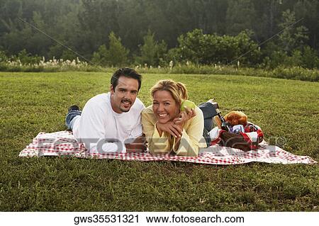 Portrait of a young woman and a mature man smiling View Large Photo Image Stock Image - Portrait of a young woman and a mature man smiling. Fotosearch