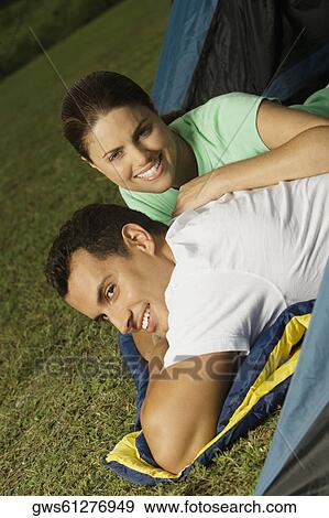 Portrait of a young woman leaning over a young man View Large Photo Image Stock Photo - Portrait of a young woman leaning over a young man. Fotosearch