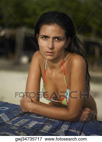 Portrait of a young woman looking serious View Large Photo Image Stock Photo - Portrait of a young woman looking serious. Fotosearch