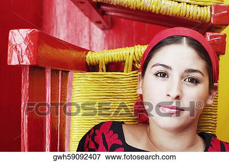 Portrait of a young woman lying on chairs View Large Photo Image Stock Photo - Portrait of a young woman lying on chairs. Fotosearch