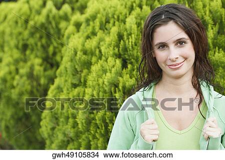 Portrait of a young woman smiling View Large Photo Image Picture - Portrait of a young woman smiling. Fotosearch