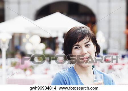 Portrait of a young woman smiling View Large Photo Image Picture - Portrait of a young woman smiling . Fotosearch