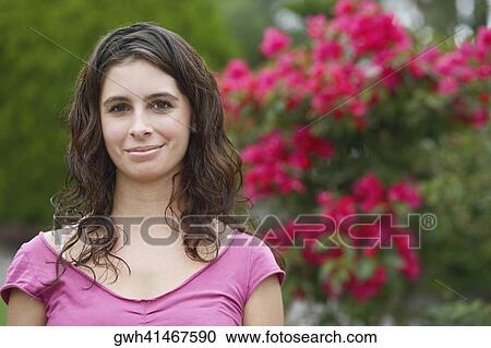 Portrait of a young woman smiling View Large Photo Image Stock Image - Portrait of a young woman smiling. Fotosearch
