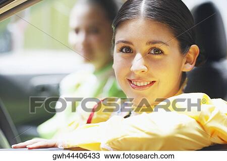 Portrait of a young woman smiling View Large Photo Image Stock Image - Portrait of a young woman smiling. Fotosearch