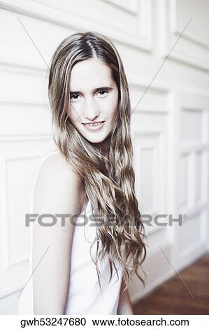 Portrait of a young woman smiling View Large Photo Image Stock Image - Portrait of a young woman smiling. Fotosearch