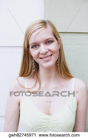 Portrait of a young woman smiling View Large Photo Image Stock Image - Portrait of a young woman smiling. Fotosearch