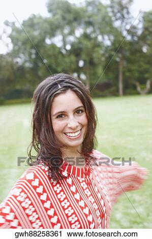 Portrait of a young woman smiling View Large Photo Image Stock Image - Portrait of a young woman smiling. Fotosearch