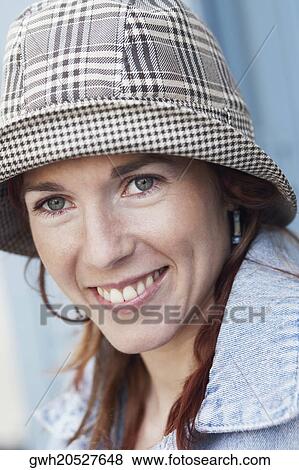Portrait of a young woman smiling View Large Photo Image Stock Photo - Portrait of a young woman smiling. Fotosearch