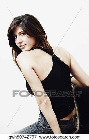 Portrait of a young woman smiling View Large Photo Image Stock Photo - Portrait of a young woman smiling. Fotosearch