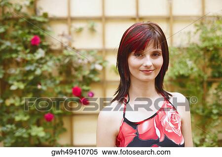 Stock Photography - Portrait of a young woman smiling. Fotosearch