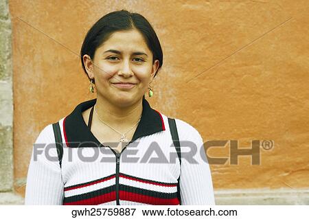 Portrait of a young woman smirking View Large Photo Image Stock Photo - Portrait of a young woman smirking. Fotosearch