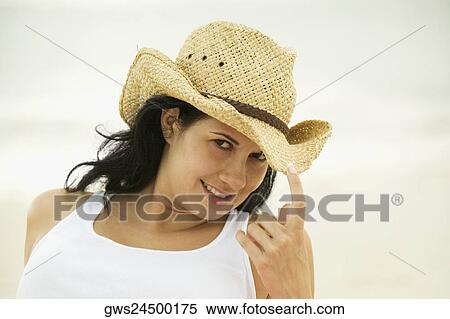 Portrait of a young woman wearing a sun hat View Large Photo Image Stock Photography - Portrait of a young woman wearing a sun hat. Fotosearch