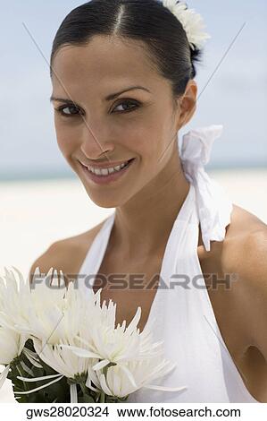 Picture - Portrait of a young woman with flowers. Fotosearch