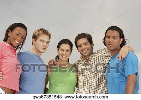 Portrait of five friends standing and smiling View Large Photo Image Stock Photo - Portrait of five friends standing and smiling. Fotosearch