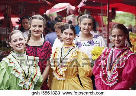 Portrait of five young women standing in a market smiling View Large Photo Image Stock Photo - Portrait of five young women standing in a market smiling. Fotosearch