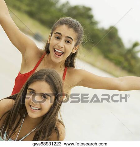 Portrait of two girls laughing View Large Photo Image Stock Image - Portrait of two girls laughing. Fotosearch