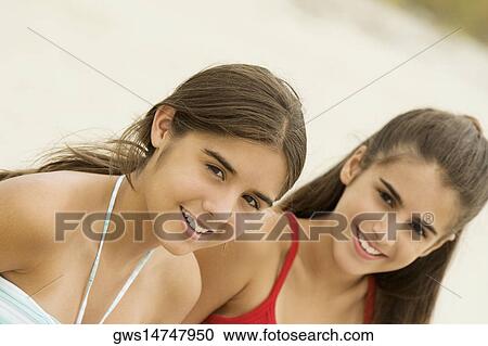Portrait of two girls smiling View Large Photo Image Stock Image - Portrait of two girls smiling. Fotosearch
