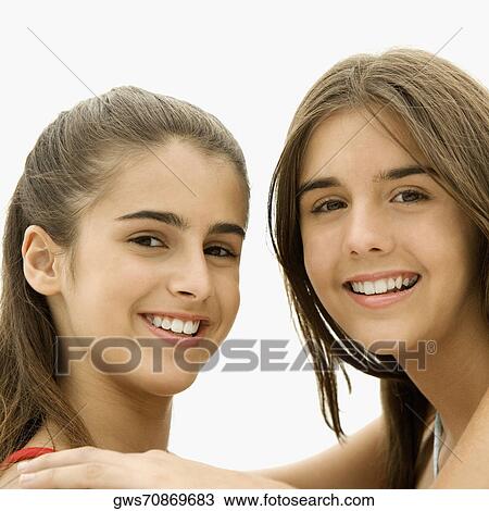 Portrait of two girls smiling View Large Photo Image Stock Image - Portrait of two girls smiling. Fotosearch