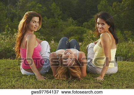 Portrait of two mid adult women and a mature woman in the park View Large Photo Image Stock Photo - Portrait of two mid adult women and a mature woman in the park. Fotosearch