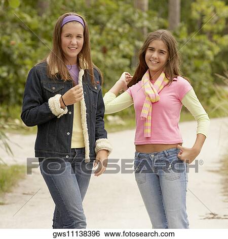 Portrait of two mid adult women smiling View Large Photo Image Stock Photograph - Portrait of two mid adult women smiling. Fotosearch