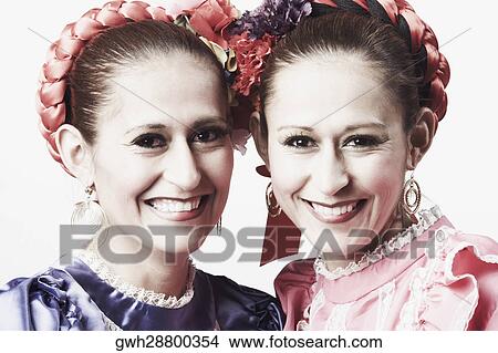 Portrait of two young women smiling View Large Photo Image Picture - Portrait of two young women smiling. Fotosearch