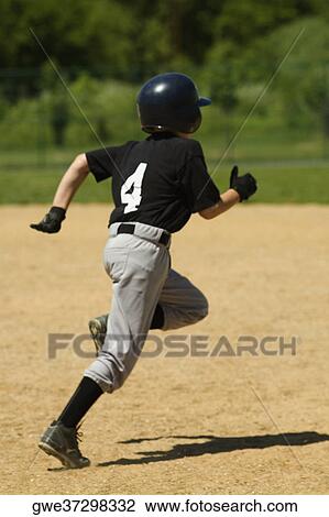 Rear view of a baseball player running View Large Photo Image Stock Image - Rear view of a baseball player running. Fotosearch