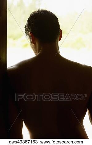 Rear view of a mid adult man leaning against a door View Large Photo Image Stock Image - Rear view of a mid adult man leaning against a door. Fotosearch