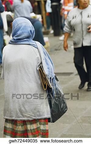 Rear view of a woman View Large Photo Image Stock Photography - Rear view of a woman. Fotosearch