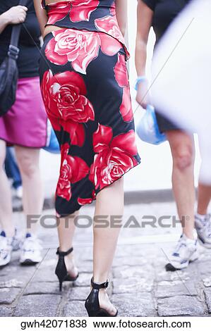 Rear view of a woman walking View Large Photo Image Stock Photo - Rear view of a woman walking . Fotosearch