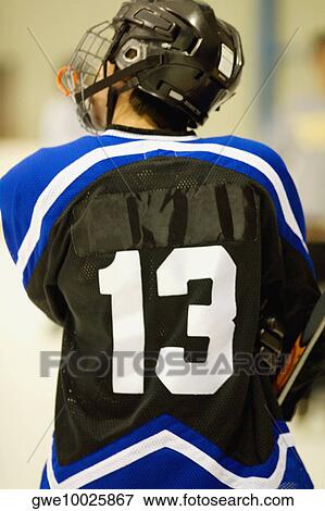 Rear view of an ice hockey player in a uniform View Large Photo Image Stock Photo - Rear view of an ice hockey player in a uniform. Fotosearch