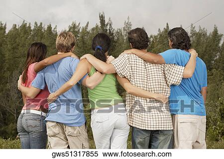 Rear view of five friends with their arms around each other View Large Photo Image Stock Photography - Rear view of five friends with their arms around each other. Fotosearch