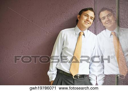 Reflection of a businessman on glass View Large Photo Image Stock Image - Reflection of a businessman on glass. Fotosearch