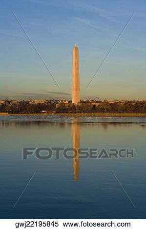 Stock Photography - Reflection of a monument in water, Washington Monument, Washington DC, USA. Fotosearch