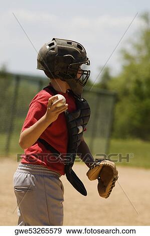Side profile of a baseball catcher throwing a baseball View Large Photo Image Stock Photo - Side profile of a baseball catcher throwing a baseball. Fotosearch