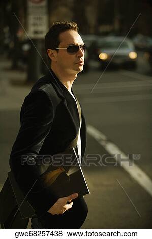 Side profile of a businessman walking on the road View Large Photo Image Stock Photo - Side profile of a businessman walking on the road. Fotosearch
