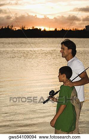 Side profile of a father and his son fishing View Large Photo Image Picture - Side profile of a father and his son fishing. Fotosearch