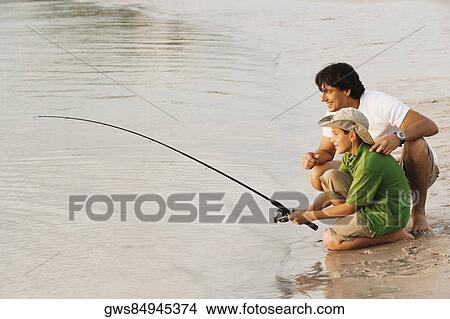 Side profile of a father and his son fishing View Large Photo Image Picture - Side profile of a father and his son fishing. Fotosearch