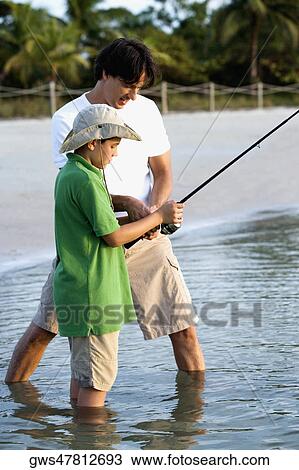 Side profile of a father and his son fishing View Large Photo Image Stock Image - Side profile of a father and his son fishing. Fotosearch