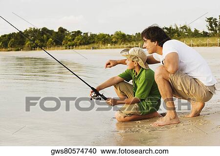 Side profile of a father and his son fishing View Large Photo Image Stock Image - Side profile of a father and his son fishing. Fotosearch
