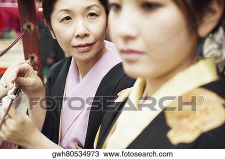 Side profile of a mature woman and her daughter View Large Photo Image Stock Image - Side profile of a mature woman and her daughter . Fotosearch