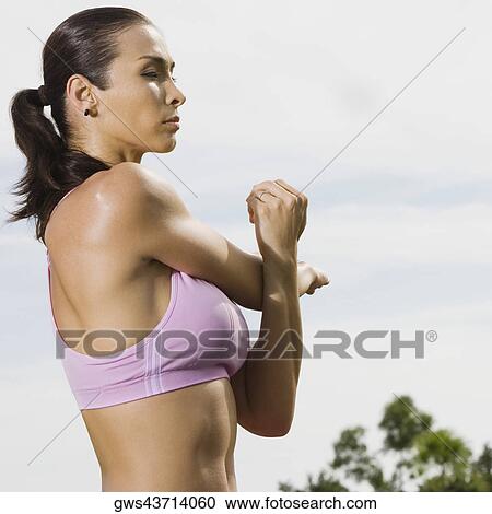 Side profile of a mid adult woman practicing martial arts View Large Photo Image Stock Image - Side profile of a mid adult woman practicing martial arts. Fotosearch