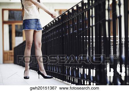 Side profile of a woman standing in the balcony View Large Photo Image Stock Photo - Side profile of a woman standing in the balcony . Fotosearch