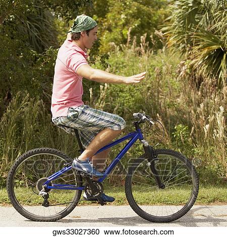 Side profile of a young man performing tricks on a bicycle View Large Photo Image Stock Image - Side profile of a young man performing tricks on a bicycle. Fotosearch