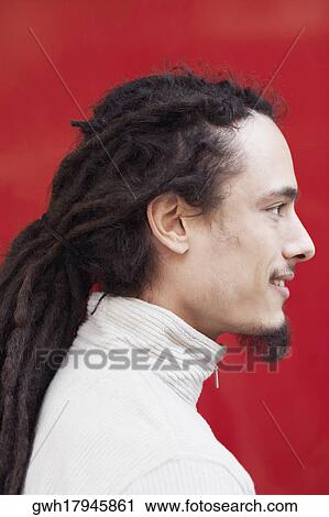 Side profile of a young man smiling View Large Photo Image Stock Image - Side profile of a young man smiling. Fotosearch